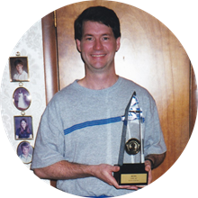 Bill Grady with 1999 NAB Award at boyhood home